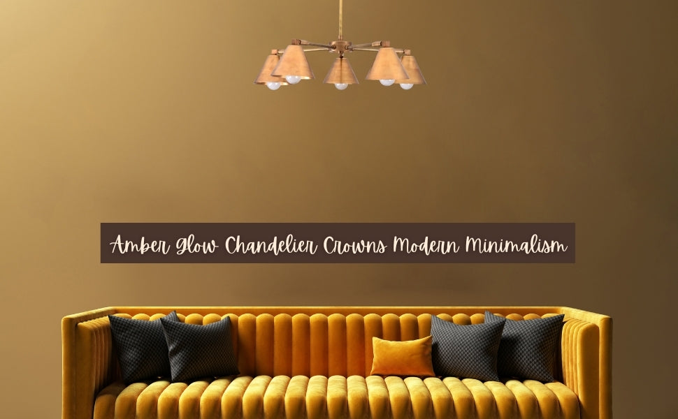 Brass chandelier glowing above a mustard sofa in a modern minimalist living room, radiating warm amber light.