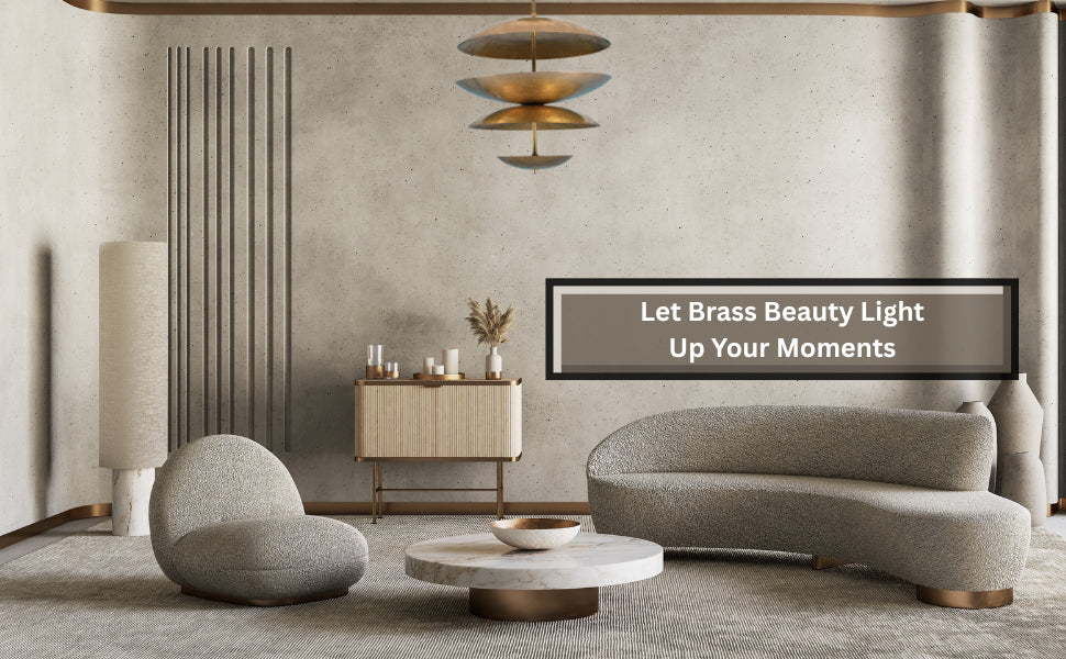 Minimalist sitting area with curvy sofas and a sculptural brass disc chandelier hanging above, adding elegance to a neutral interior