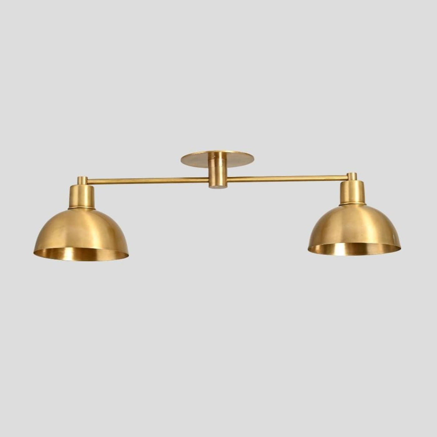 Brass double dome flush mount ceiling light with minimalist industrial design.