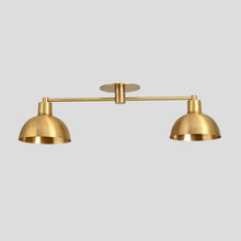 Brass double dome flush mount ceiling light with minimalist industrial design.