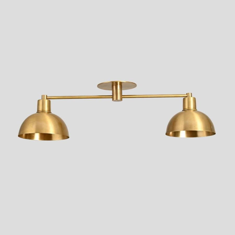 Brass double dome flush mount ceiling light with minimalist industrial design.