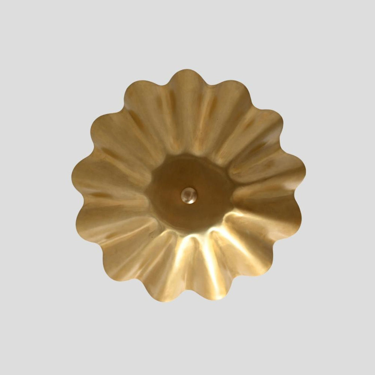 Top view of brass floral wave ceiling light showcasing petal-like design in brushed brass finish