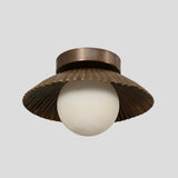 Vintage-inspired solid brass flush mount ceiling light with pleated scalloped detailing and warm antique patina finish, perfect for bedrooms, dining areas, or boutique spaces.