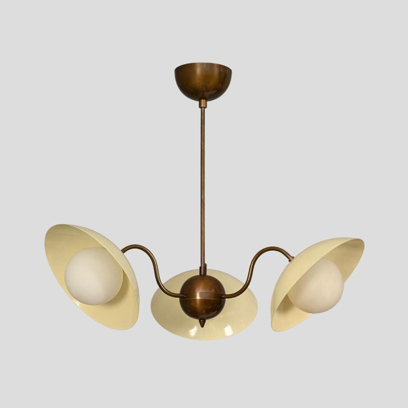 Handmade brass chandelier with three cream bowl-shaped shades and globe lights, modern vintage ceiling light.