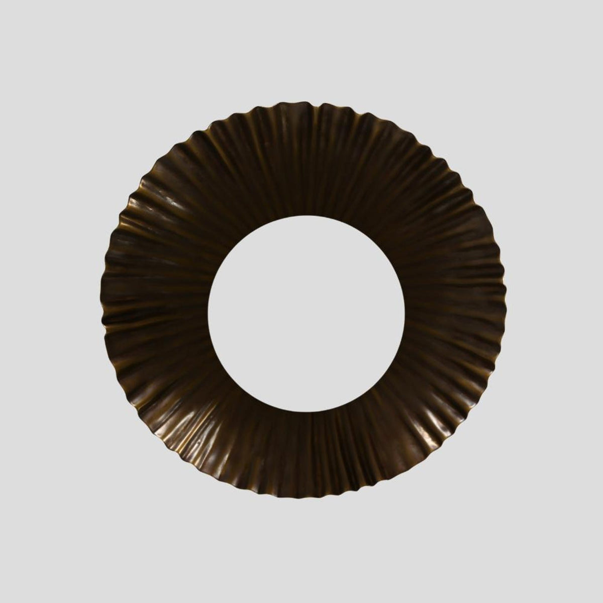 Bottom view of scalloped brass flush mount ceiling light with pleated circular design, showcasing handcrafted artisanal detailing for elegant modern interiors.