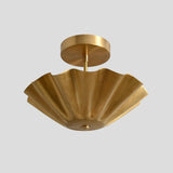 Brass semi-flush ceiling light featuring a ruffled shade and premium industrial-grade brass construction