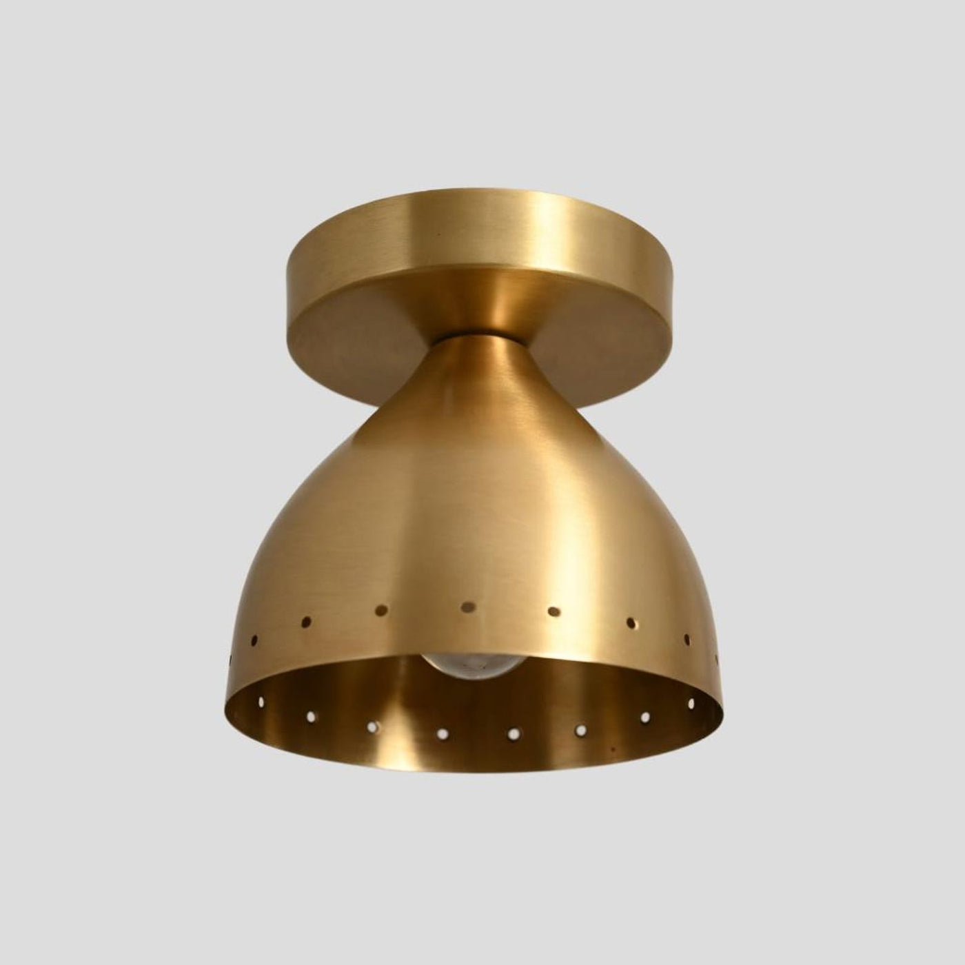 Modern brass semi flush mount ceiling light with perforated shade design, handcrafted from solid brass for warm ambient lighting.