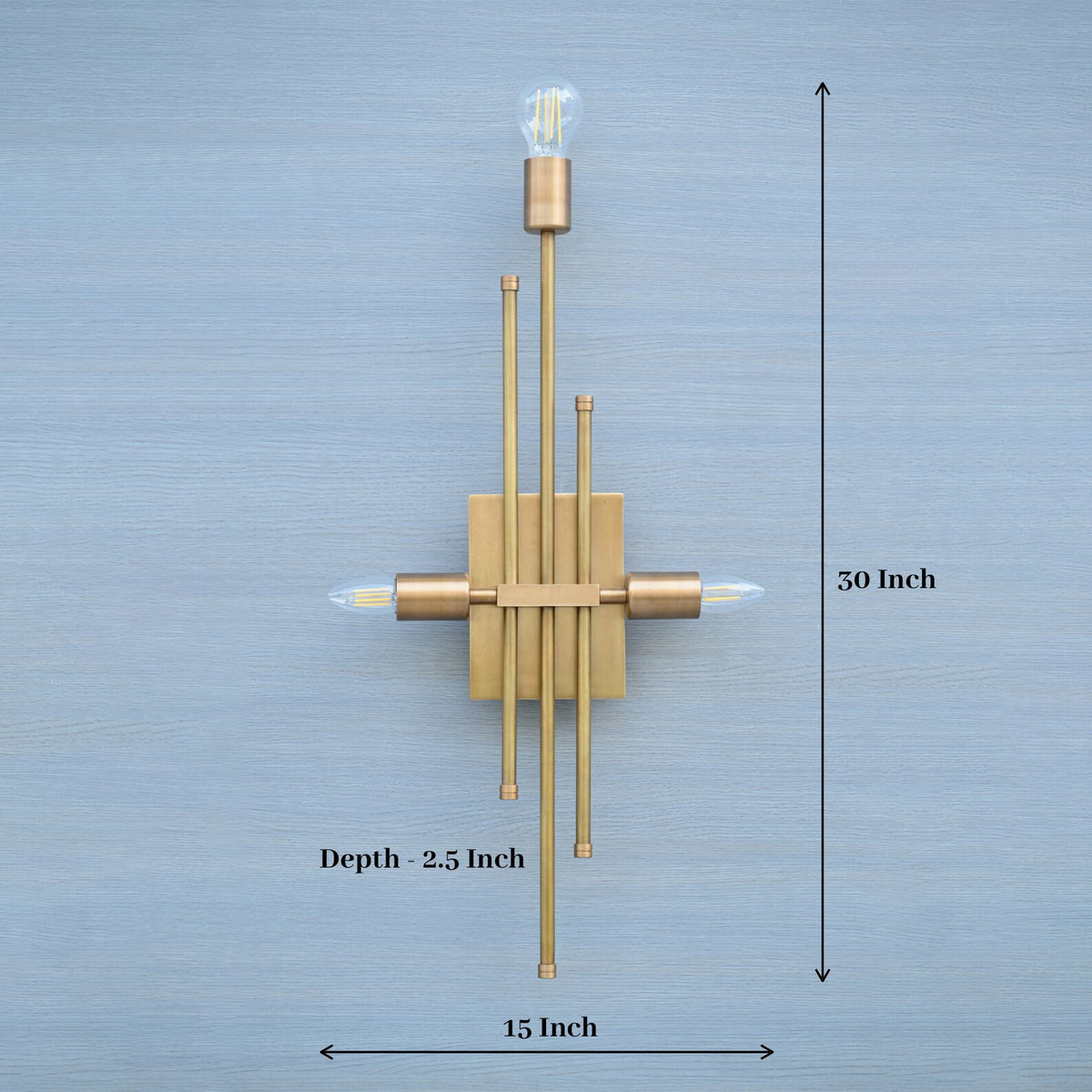 Brass wall sconce with vertical rods and triple bulb holders, dimensions 15 inches wide and 30 inches tall displayed on image.