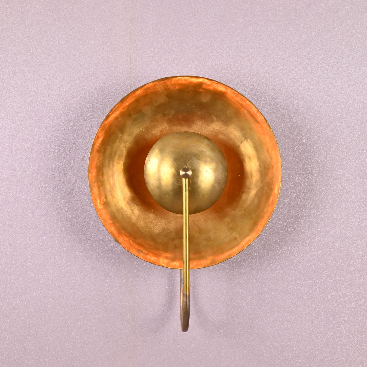 Handmade brass wall sconce with bowl-shaped shade and U-arm, artisan-crafted modern wall light