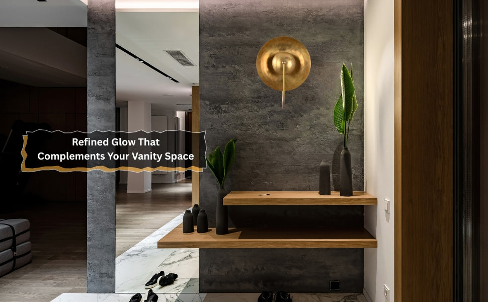 Entryway with handcrafted brass wall sconce mounted on dark wall, warm halo glow enhances modern interiors