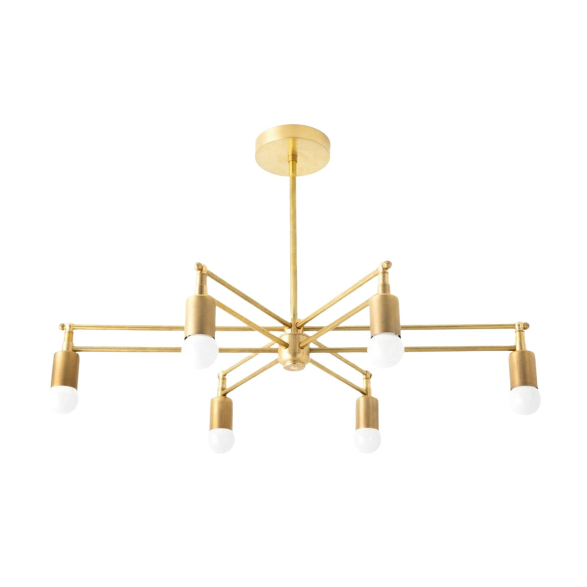 Brighton 6 light brass chandelier shown from the front with geometric intersecting arms and exposed globe bulbs.