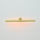  Front view of Brisbane 4 light polished brass picture light with sleek horizontal tubular design and warm illumination.