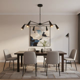 Bruges 6 light matte black chandelier shown from the front with six radial arms and tapered metal cone shades.