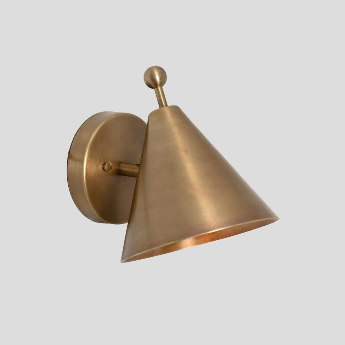Decorative brushed brass cone wall lamp with a spherical finial and industrial-inspired design, ideal for accent lighting.