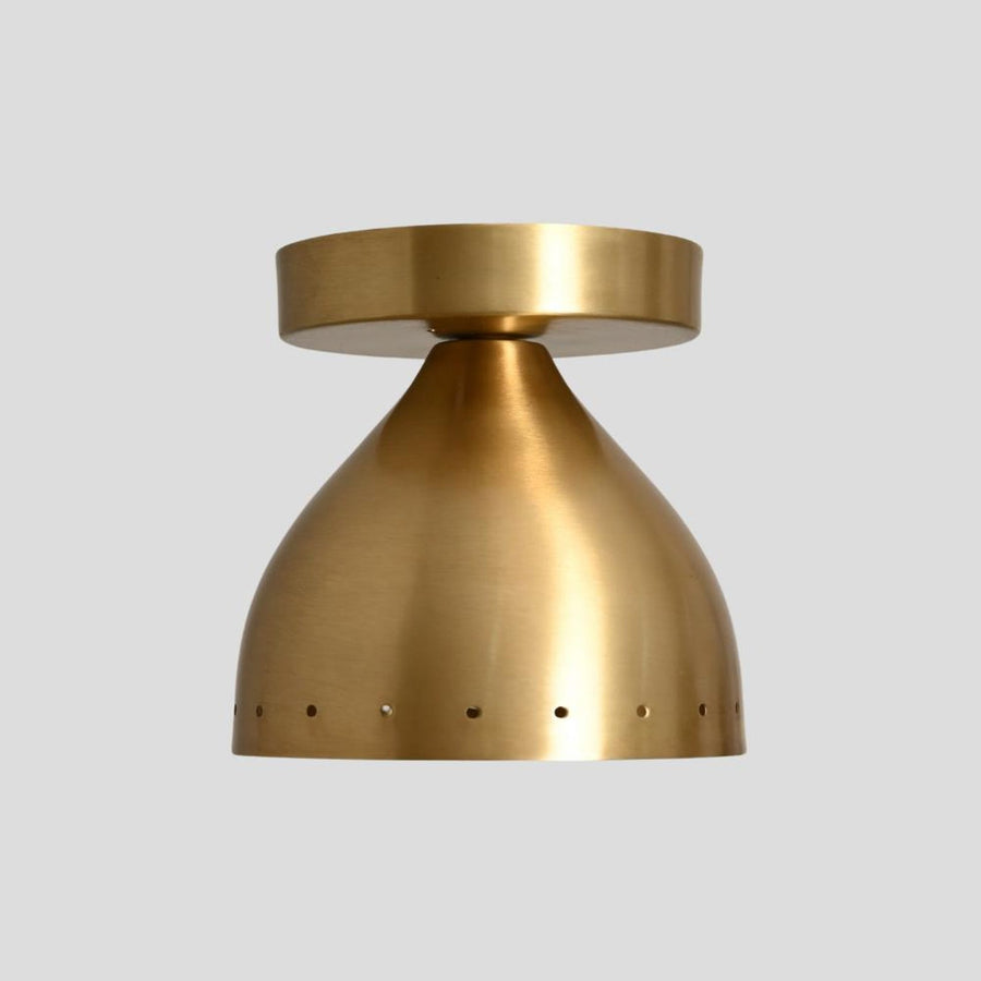 Modern brass semi flush mount ceiling light with perforated shade design, handcrafted from solid brass for warm ambient lighting.