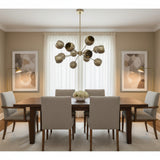 Brussels 12 light aged brass globe chandelier shown in a full product view with sculptural shades and fixed rod suspension.