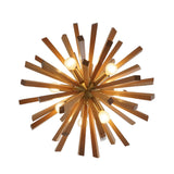 Close-up view of the Brussels 8 light wooden starburst chandelier illuminated with globe bulbs and warm brass-tone holders.