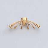 Angled view of the Cairo 12-light brass chandelier highlighting gracefully curved metal arms, tapered cone-shaped holders, and a compact central ceiling mount.