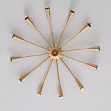 Bottom view of the Cairo 12-light Sputnik chandelier showcasing twelve radially arranged brass-tone arms, elongated cone bulb holders, and a symmetrical starburst-inspired structure.