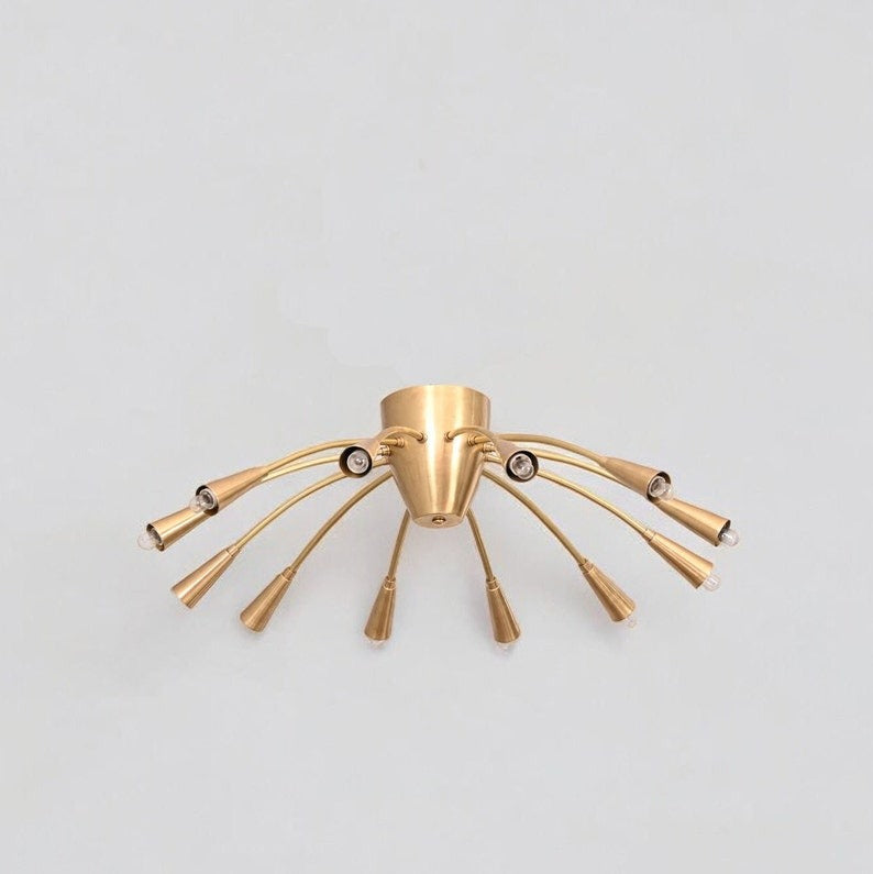 Cairo 12-light sculptural ceiling chandelier displaying a flowing arrangement of curved brass-tone arms, exposed bulb holders, and a distinctive Mid-Century Modern silhouette.