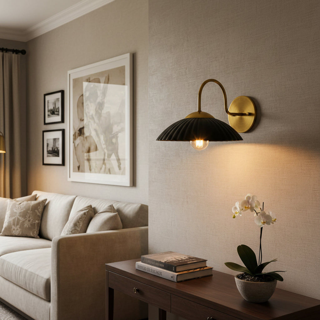 Cambria fluted dome wall sconce with black ribbed shade and curved brass arm – Model 32785