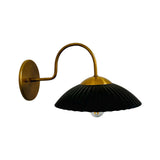 Side view of Cambria black fluted dome wall sconce with curved brass arm and round canopy – Model 32785