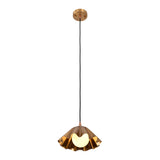 Illuminated front view of the Cambria Fluted Petal Pendant Light showcasing its sculptural fluted brass shade and warm ambient glow from the exposed globe bulb.