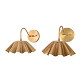 Pair of Cambria modern pleated brass wall sconces displayed from the front with decorative scalloped shades.