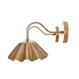 Side profile of Cambria modern brass wall sconce highlighting the graceful curved arm and handcrafted pleated metal shade.
