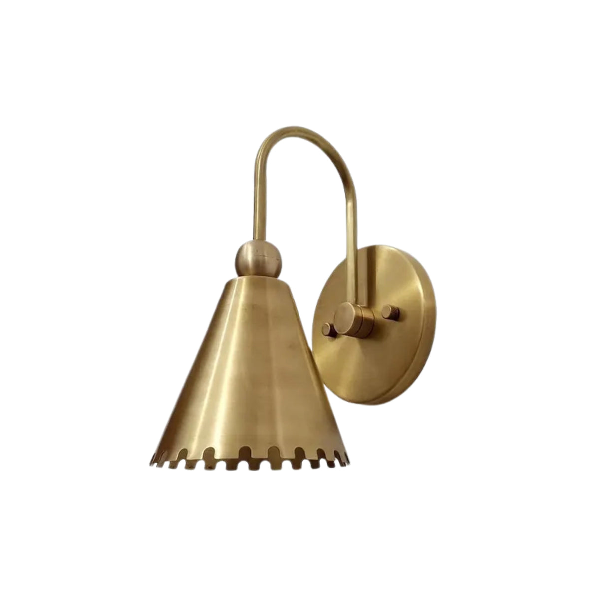 Cambria Scalloped Cone Wall Sconce featuring a handcrafted brass cone shade with decorative scalloped edge, curved brass arm, and round wall canopy.