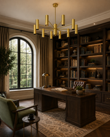 Cambridge 10 light brass chandelier illuminating an elegant home office with dark wood bookshelves and classic furnishings.