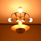 Capri Globe Disc Chandelier close illuminated view with glowing globes, radial frame, and lower bowl shade.