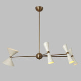 Angled view of the Catania 8-light Mid-Century Modern chandelier showcasing its tapered ivory cone shades, warm brass-tone frame, branching arms, and sculptural geometric design.