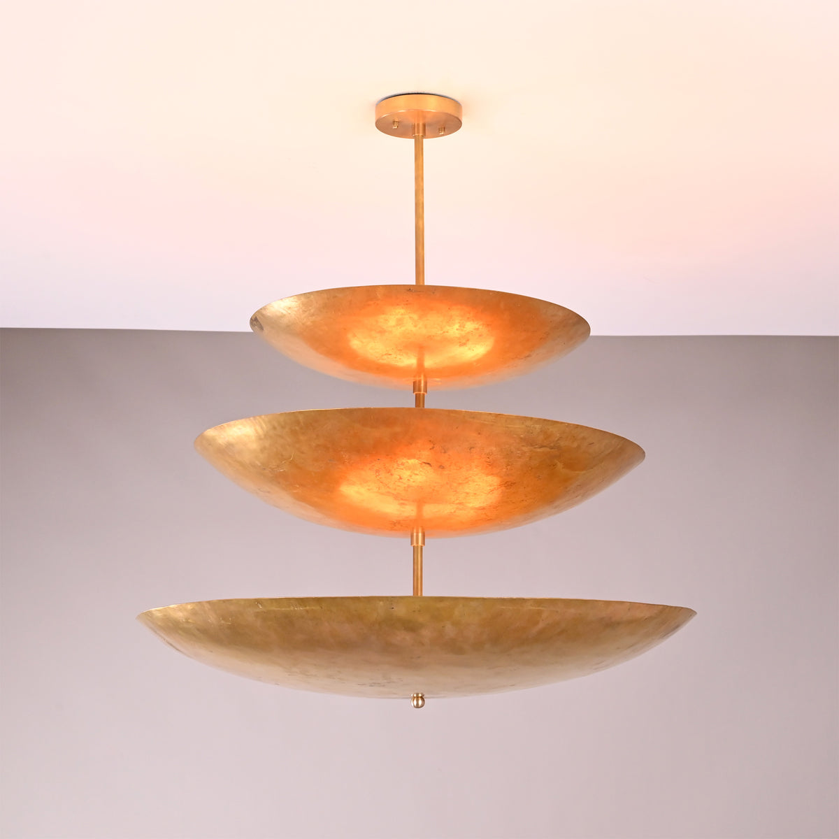 Angled view of Celeste Triple Saucer Pendant Light showing layered three tier shade structure.