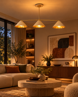  Charleston ivory and brass three-light chandelier illuminating a cozy mid-century living room with neutral sofa, round coffee table, and warm decor.