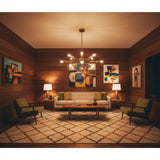 Chicago 12 light brass-tone Sputnik chandelier shown from an alternate front view highlighting its spherical hub and multi-directional arms.