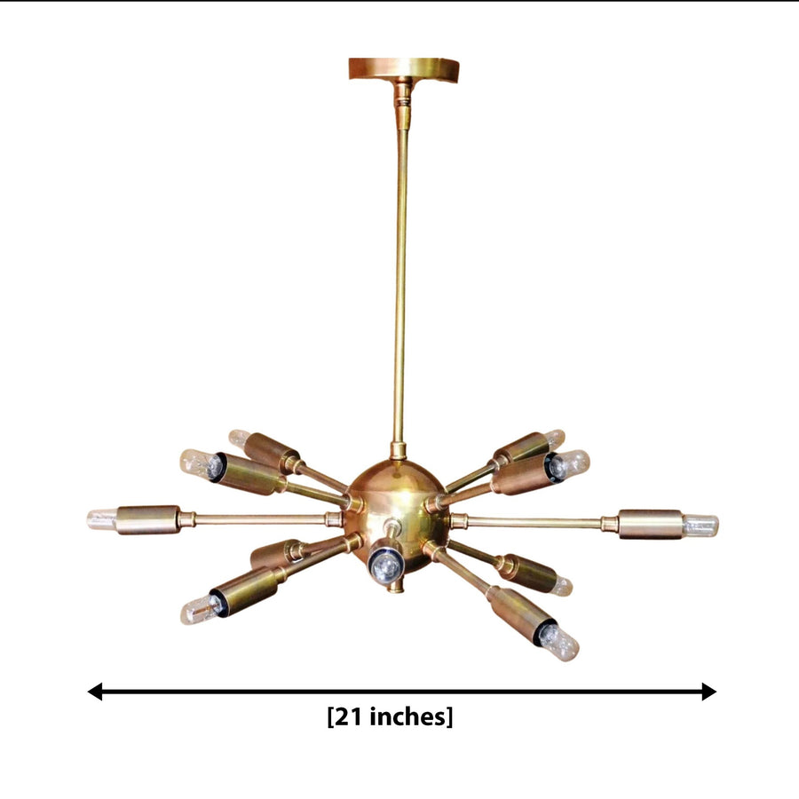 Chicago 12 light brass-tone Sputnik chandelier shown illuminated from an angled view with exposed bulbs and sculptural radial arms.