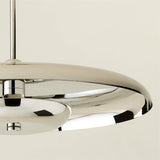 Close-up of chrome disc chandelier edge and underside showcasing smooth reflective finish and modern craftsmanship.