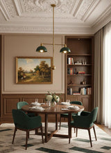 Elegant dining room with classic wall detailing, wooden furniture, and a brass pendant light with green dome shades.