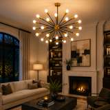 Cologne 24 light brass and black radial Sputnik chandelier illuminated in an elegant modern living room with warm ambient lighting.