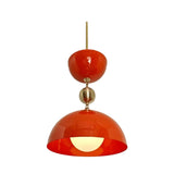 Cologne 1 light orange-red dome pendant shown illuminated with warm light, brass-tone spherical accent and sculptural upper bowl.