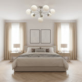 Como 8 light Mid-Century Modern Sputnik chandelier featuring opal glass globes and polished silver-tone radial arms.
