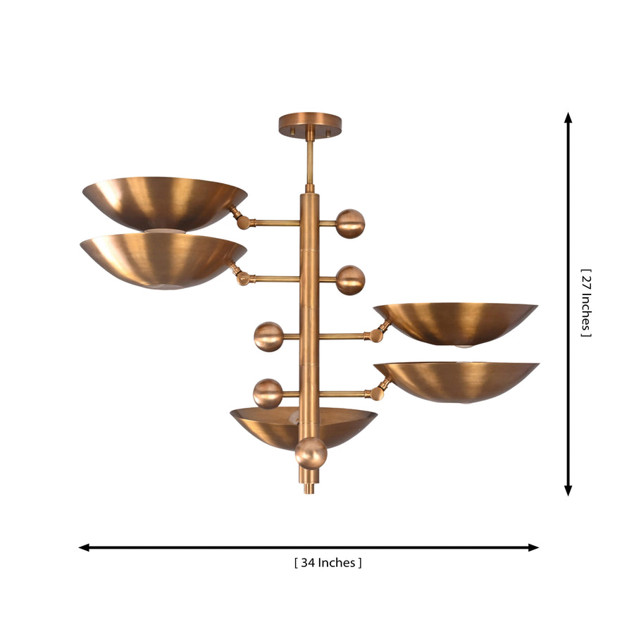 Como Orbital chandelier installed above a dining table, creating warm Mid-Century Modern ambient lighting.