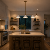 Corfu 3 light white cone linear chandelier installed above a kitchen island with warm ambient lighting.