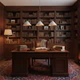 Corfu 3 light linear chandelier detail view showcasing three wide white cone shades with brass trim.