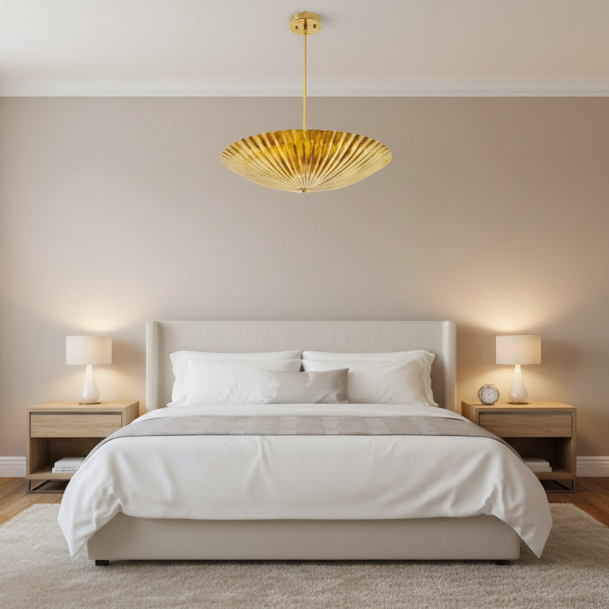 Crete 5 light brass fluted bowl chandelier shown from an angled view highlighting the deep radial pleats and wide bowl silhouette.