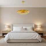 Crete 5 light brass fluted bowl chandelier shown from an angled view highlighting the deep radial pleats and wide bowl silhouette.