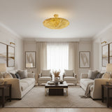 Crete 5 light brass fluted bowl chandelier shown from a low angle with detailed pleating and sculptural circular form.