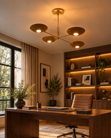 Dallas 4-light sculptural brass chandelier illuminating a sophisticated home office with a walnut desk, leather executive chair, and warm wooden shelving.