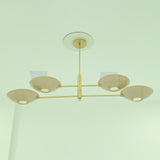  Dallas 4-light sculptural linear chandelier featuring four shallow bowl shades, a brass-finished frame, and modern ceiling-mounted design.